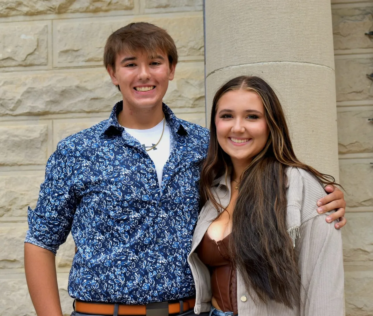 Professional family portrait with coordinated outfits
