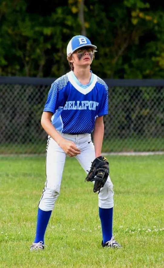 Young male baseball player in fielding position